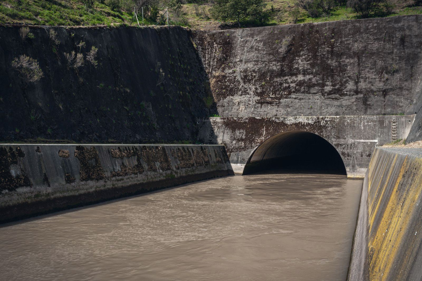 Water running through a concrete tunnel